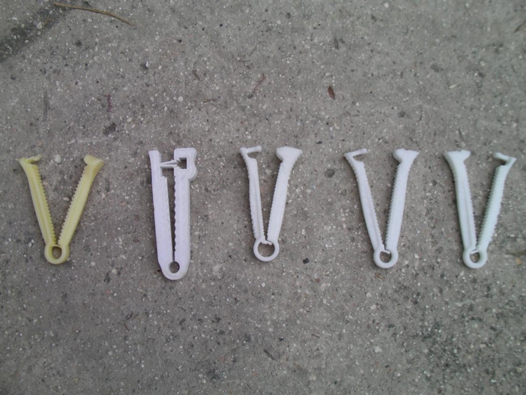 The umbilical cord clamps printed in Haiti have undergone some design iterations, as can be seen by examining the original clamp (far left) and new models. Courtesy of Field Ready.