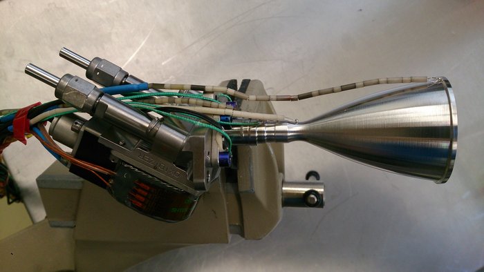 Witness the 3D printed platinum thrust chamber, still shiny and chrome after repeated test firings. Courtesy of ESA.