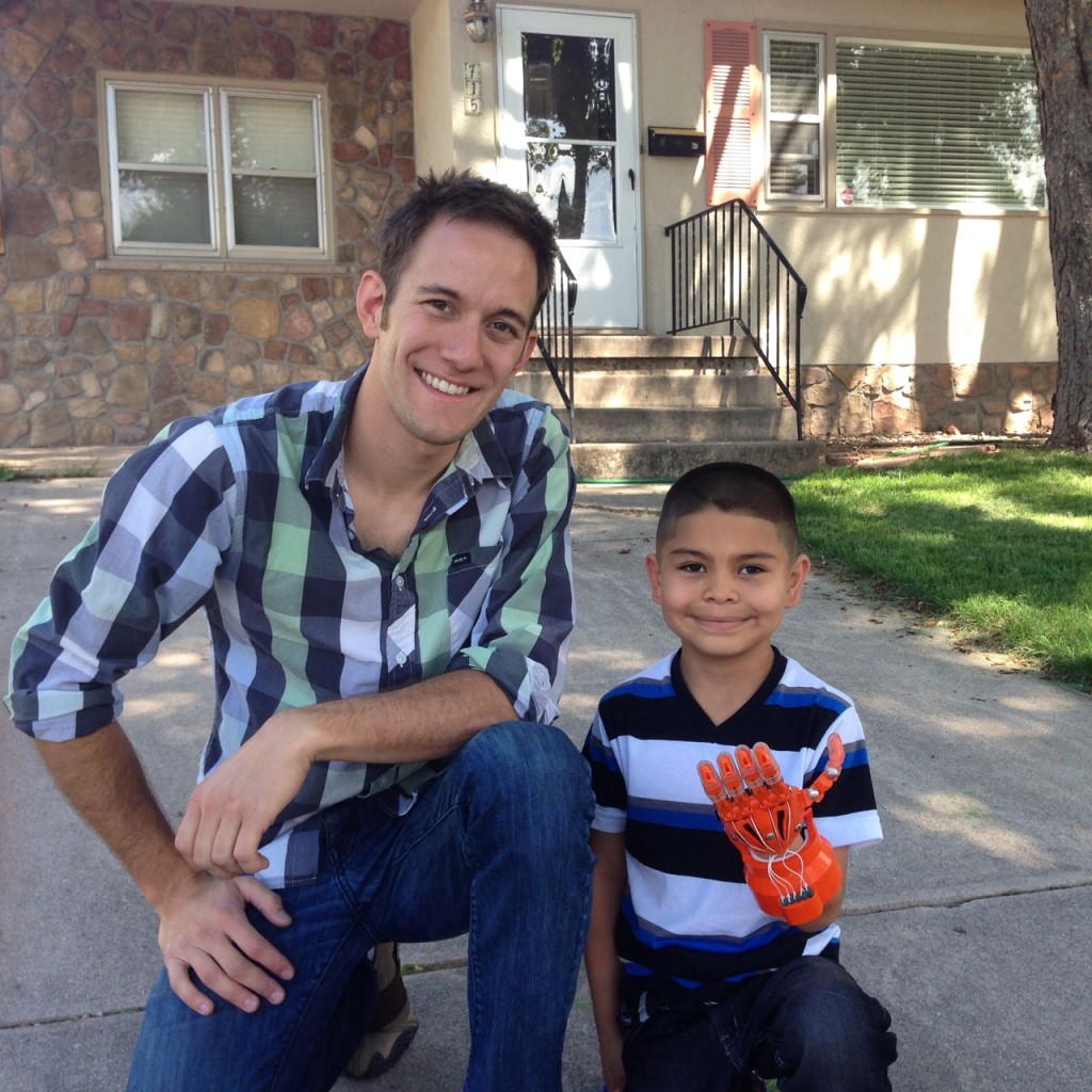Clay Guillory with Dominic Martiniez, the 8-year-old recipient of a prosthetic hand Guillory created for him via e-NABLE.