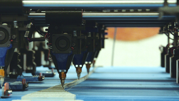 Closeup of the multiple printer heads working in concert (image courtesy of Autodesk).