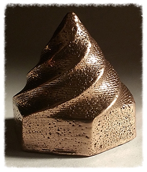 A part printed from Filamet and heat treated. Note the strata still present after firing. Courtesy of the Virtual Foundry.
