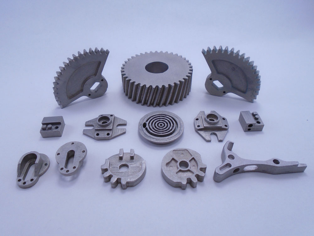 Sample metal parts 3D-printed on 3DEO's industrial AM system. All parts are 17-4PH stainless steel, shown directly out of the machine with no post-processing; the largest is about 2 inches diameter. (Image courtesy 3DEO)