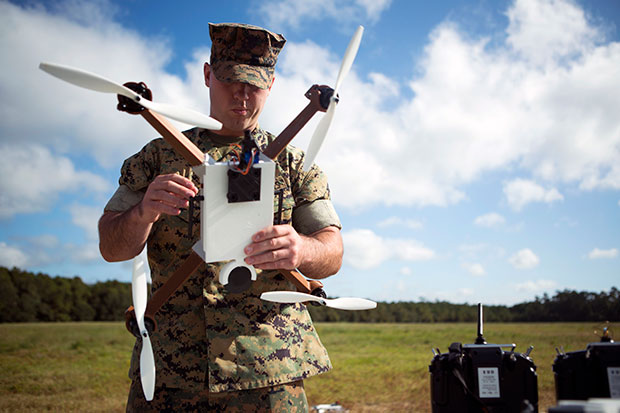 Marine Corps Lance Cpl. Nicholas D. Hettinga looks at a 3D printed unmanned aircraft system. Marine Corps photo by Cpl. John A. Hamilton Jr. 