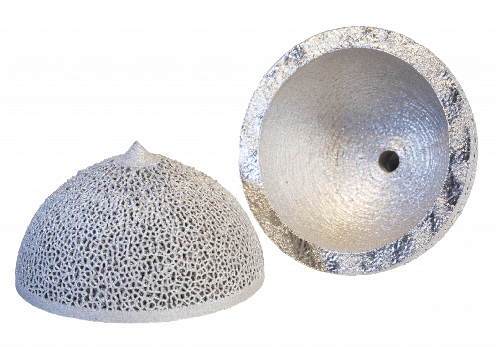 Titanium acetabular cup implants, printed without supports on a Velo 3D Sapphire system. One build run can produce more than 400 such parts. (Image courtesy Velo 3D)