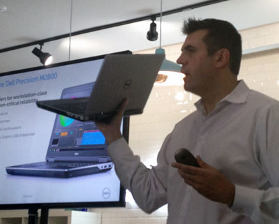 Andy Rhodes holds the Dell Precision M2800 mobile workstation aloft at its official introduction in Austin, TX.