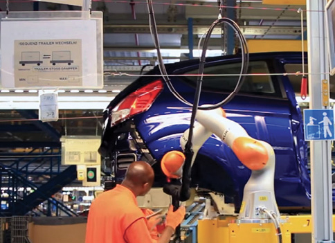 Ford has installed cobots in its Fiesta plant in Germany to automate the installation of shock absorbers. Image: Ford