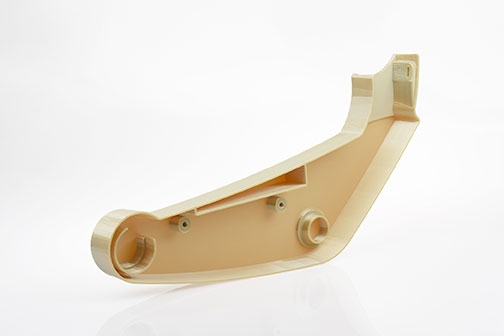 A Stratasys Fortus 900mc 3D printed this armrest component with Certified ULTEM 9085, a strong, lightweight thermoplastic that meets aircraft flame, smoke and toxicity regulations. Image courtesy of Stratasys Ltd.