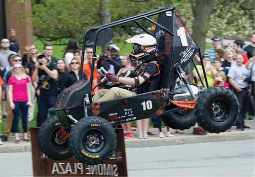 A competitor in the Baja Student Design Competition gets some air. Image courtesy of RIT.