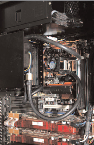 The rubber hoses surrounding the CPU are part of an active liquid cooling system to chill the overclocked QX9650 processor.